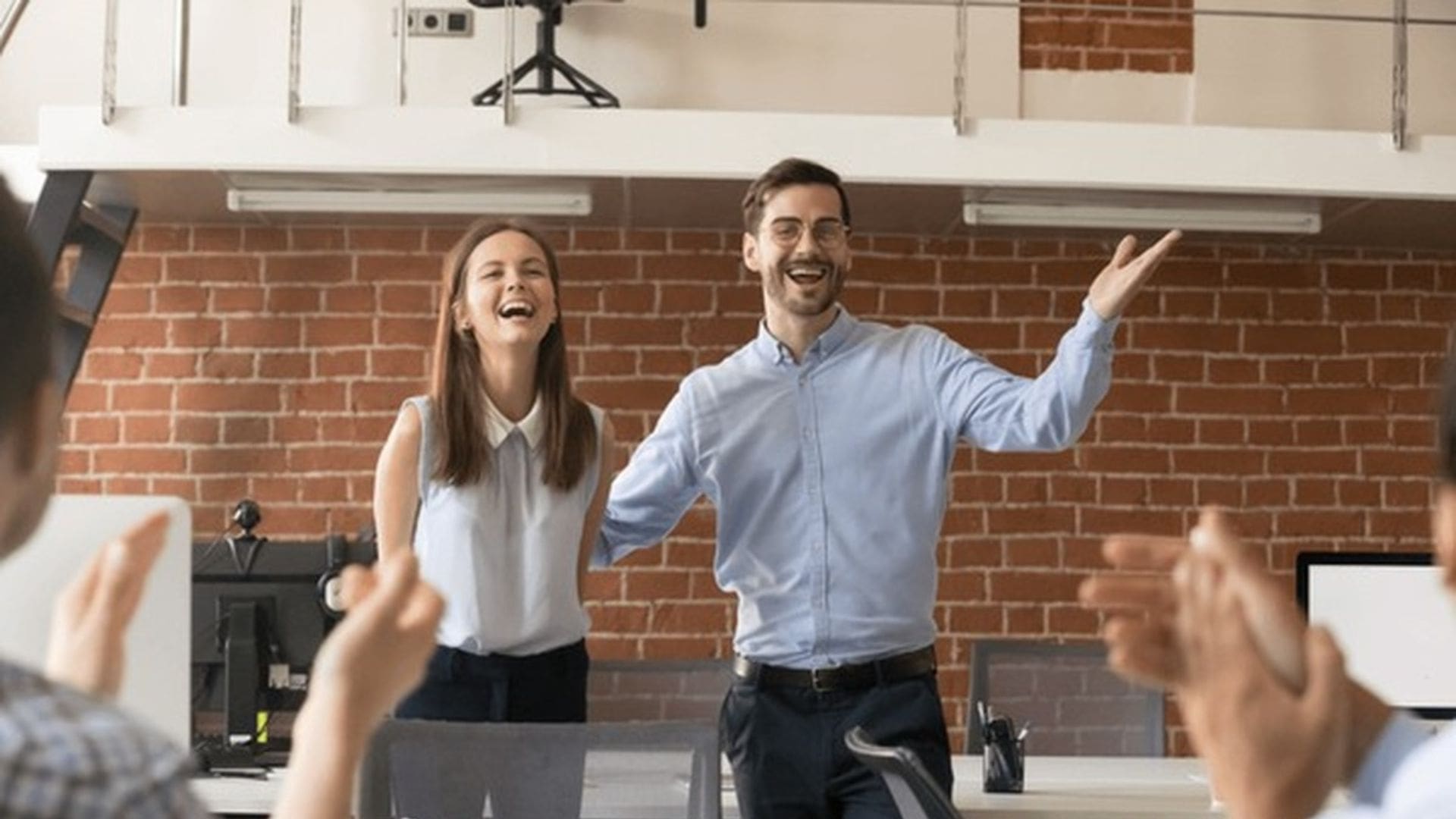 Business owner reviewing hiring timeline and team building strategy with revenue thresholds for first employee